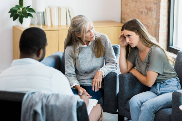 istock In therapy, daughter, angry at mother, avoids looking at her 1341502874