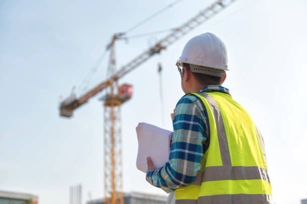 istock Civil engineer inspects work using radio communication with the management team in the construction area. 1341502933