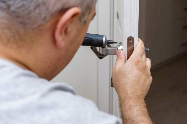 istock man changing the door lock at home 1341503294