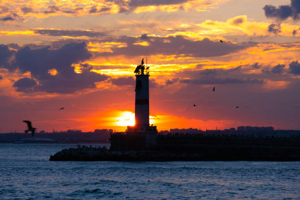 istock lighthouse and breakwater view. dramatic sunset. kadikoy, istanbul, turkey. 1341508422