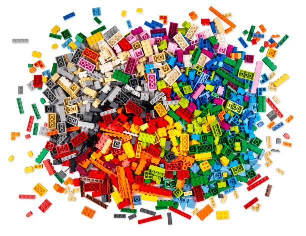 istock huge pile of stackable plastic toy bricks top view isolated white background.  Colorful texture childhood education and development concept. 1341508726