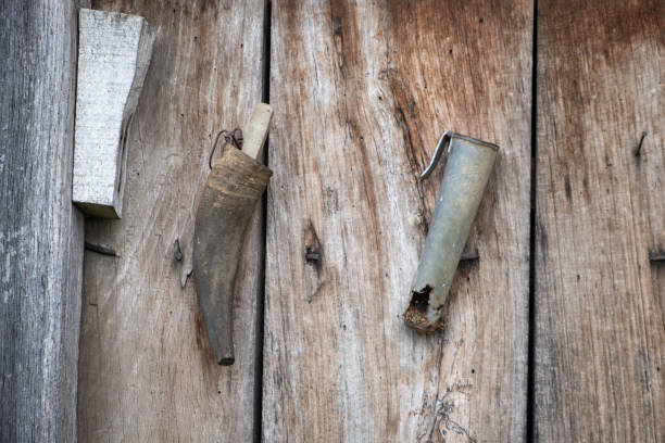 istock Old, rustic sharpener rock hanging from a wooden wall 1341513656
