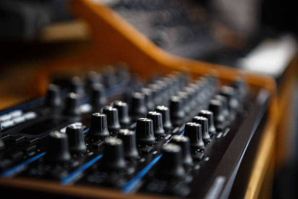 istock Analog modular synth in music store. Modern electronic synthesizer device for musical production. Knobs and volume regulators in focus 1341513734