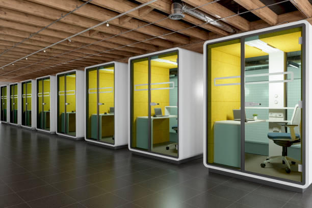 istock Side View Of Modern Office Cubicles Placed According To Social Distancing 1341514962