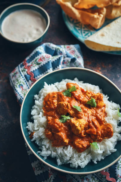 istock Indian Chicken Curry with Naan Bread and Pappadom 1341518523
