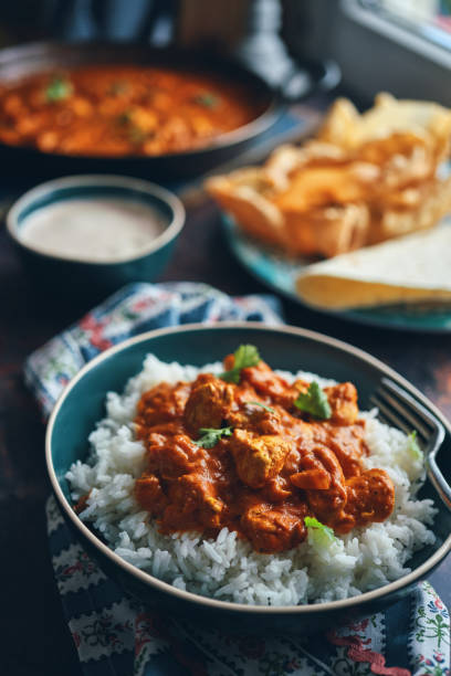 istock Indian Chicken Curry with Naan Bread and Pappadom 1341518535