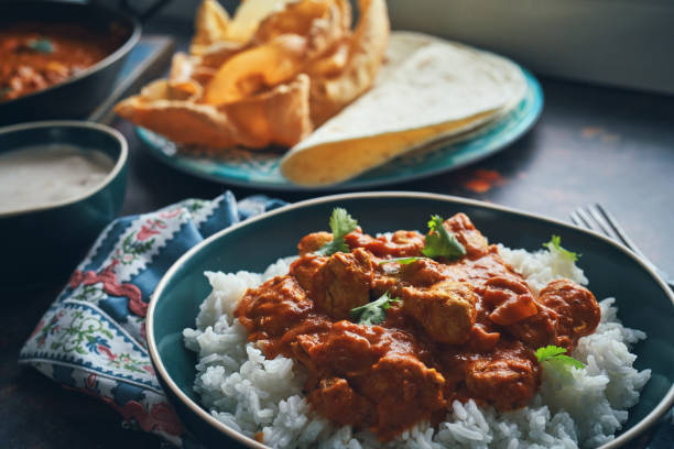 istock Indian Chicken Curry with Naan Bread and Pappadom 1341518587