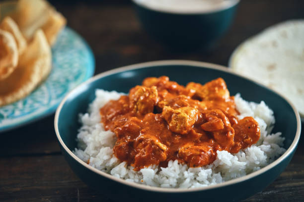 istock Indian Chicken Curry with Naan Bread and Pappadom 1341519792