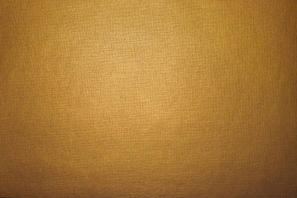 istock Soft, subtle gold background; golden paper texture 1341520496