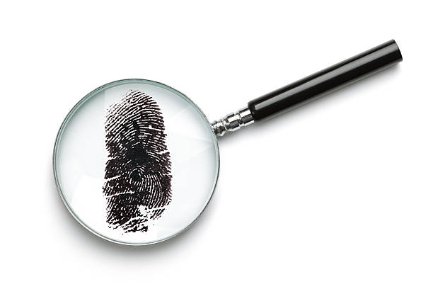 istock Magnifying glass examining fingerprint 134152067