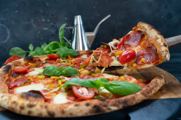 istock Pizza with salami and tomatoes 1341523438