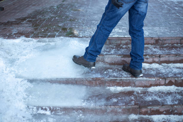 istock a man walks up the stairs with ice steps 1341525884