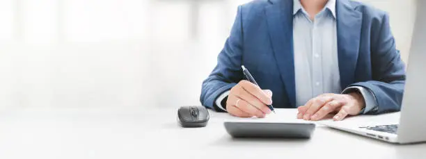 Photo of Businessman, accountant working in office