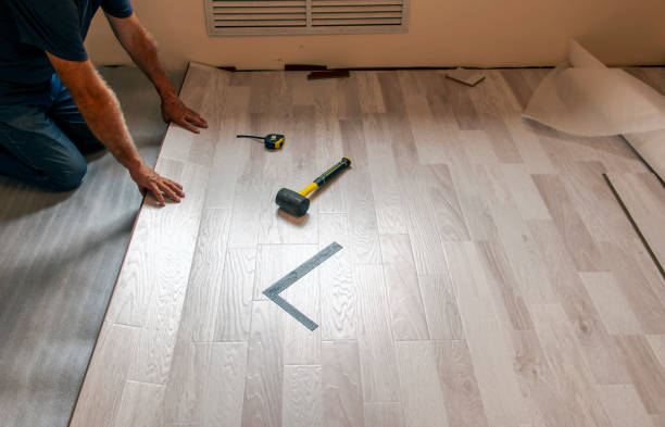 istock Locking longitudinal joint, floating floor laying technology. Laying laminate flooring. Selective focus. 1341530238