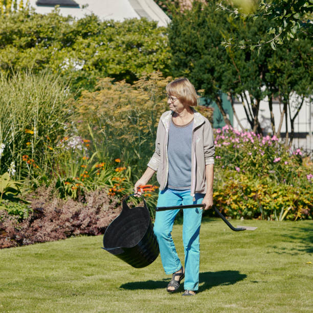 istock Woman with garden tool 1341530500