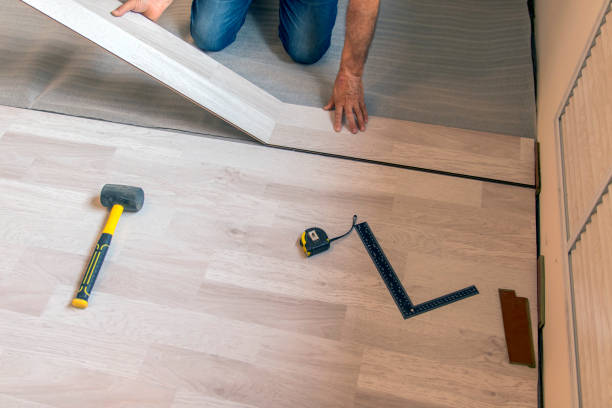 istock worker lays laminate flooring on a substrate while renovating a house 1341530507