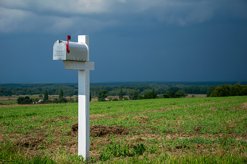 US mailbox in the countryside with sky background