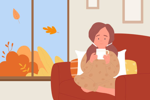 ilustrações de stock, clip art, desenhos animados e ícones de cute girl drinking hot drink at home, kid holding tea cup to keep warm in autumn weather - cair no sofá