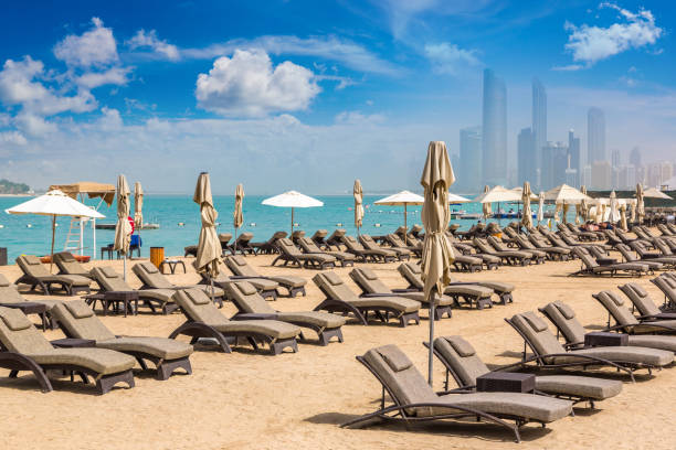 istock Sunbeds at the beach in Abu Dhabi 1341531916