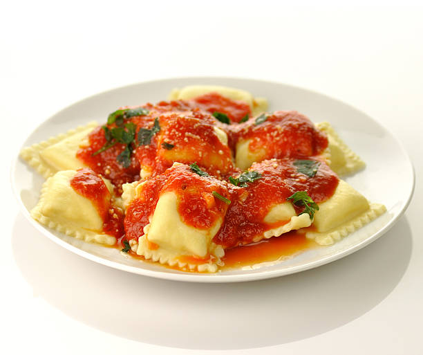 Ravioli pasta with red tomato sauce stock photo