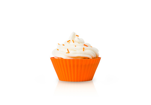 Cupcake with white cream in orange form isolated on a white background.
