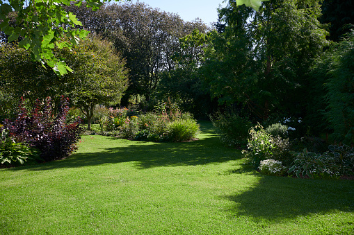 Big private garden in the countryside. Well kept garden with big lawn and flowerbeds.