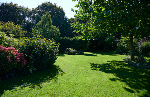 Big private garden in the countryside. Well kept garden with big lawn and flowerbeds.