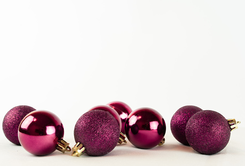 Bright crimson Christmas balls on a white background