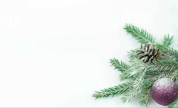 istock On a spruce branch a cone and a Christmas balloon 1341536366