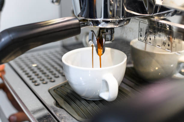 istock prepares espresso in his coffee shop; close-up. 1341536752