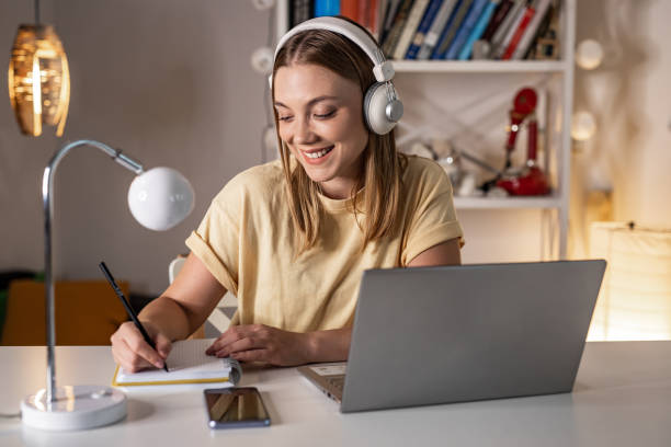 istock Young woman attending online class at home 1341538397
