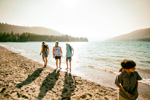 istock Beautiful Multigenerational  Family walking and playing along a lake front 1341538409