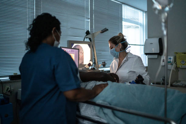 istock Doctor examining patient with endoscope 1341539227