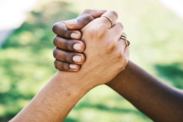 istock Interracial Hands Outdoors 1341540833