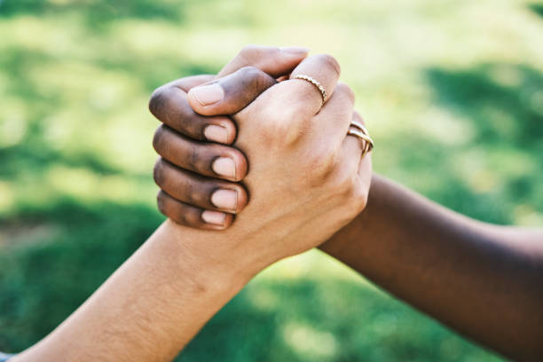 istock Interracial Hands Outdoors 1341540838