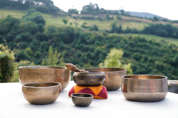 istock Authentic Tibetan singing bowls prepared for an alternative therapy outdoors. 1341541726