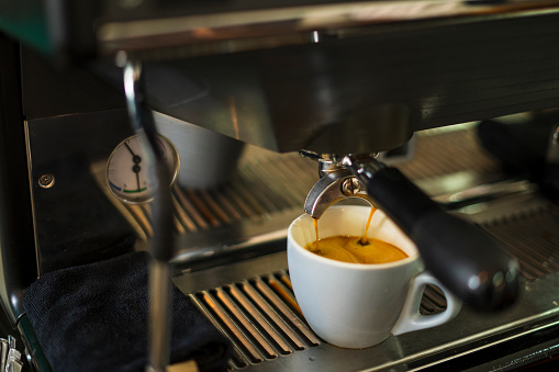 electric coffee maker prepares espresso
