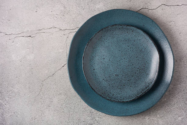 istock Empty plate on the slate table. Top view of the image. 1341547593