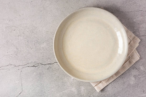 istock Empty plate on the slate table. Top view of the image. 1341547616