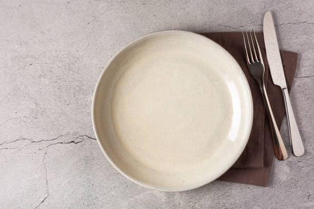 istock Empty plate on the slate table. Top view of the image. 1341547620