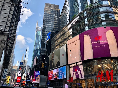 Manhattan New York City, New York United States - August 27 2021: H&M clothing store near Times Square with red logo trademark.
