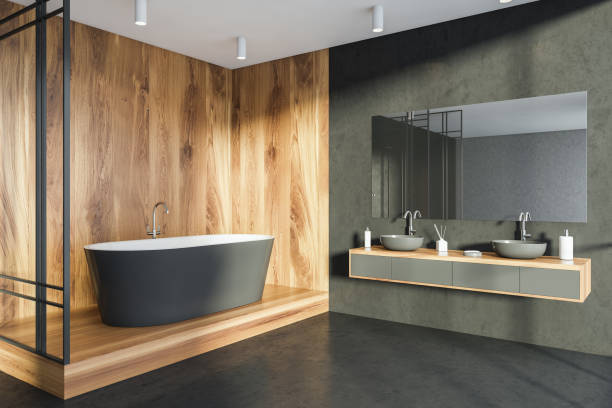 istock Wooden space with bathtub in dark stone bathroom. Corner view 1341548378