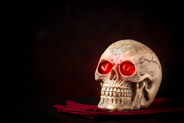 istock Halloween catrine skull on an black table in dark background. 1341550619