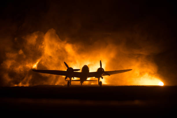 istock German Junker (Ju-88) night bomber at night. Artwork decoration with scale model of jet-propelled plane in possession. Toned foggy background with light. War scene. 1341551200