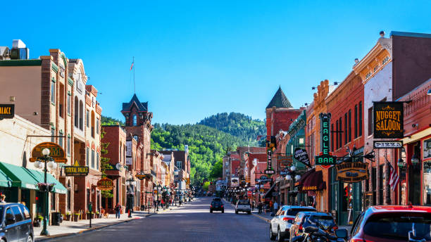 Deadwood, South Dakota Deadwood, South Dakota - Crowded historic downtown main street with shops, saloons, restaurants, casinos etc main street stock pictures, royalty-free photos & images