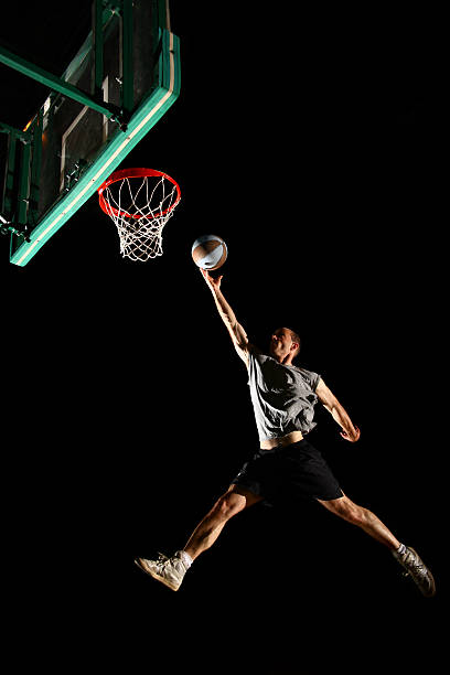 istock Basketball jump isolated on black background 134155258