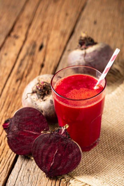 istock Red beet juice in a glass cup on the wooden table. 1341555744