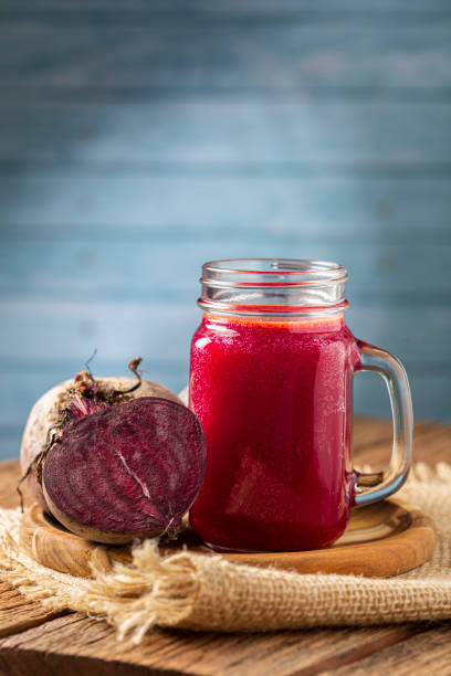 istock Red beet juice in a glass cup on the wooden table. 1341555791