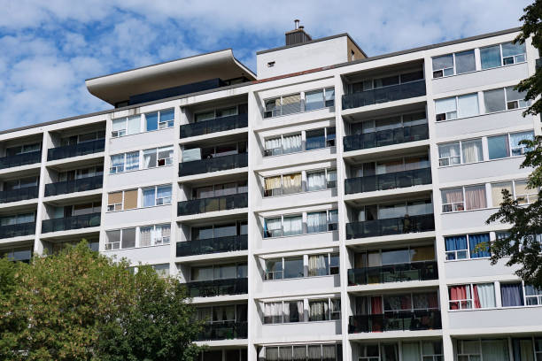istock Large brick rental apartment building with balconies 1341555802