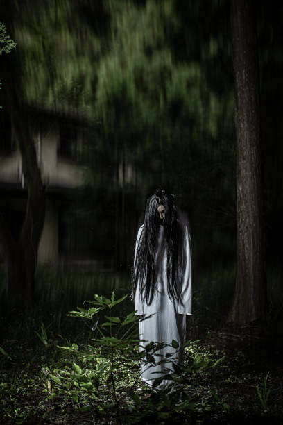 istock Scary Japanese witch ghost with abandoned house in forest 1341557974